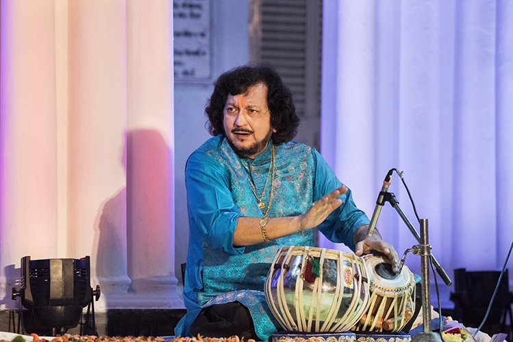 Kumar Bose plays the tabla on stage